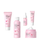 Set of Japanese skincare products with step-by-step instructions on a light pink background