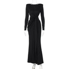 Black evening gown with long sleeves on a white background