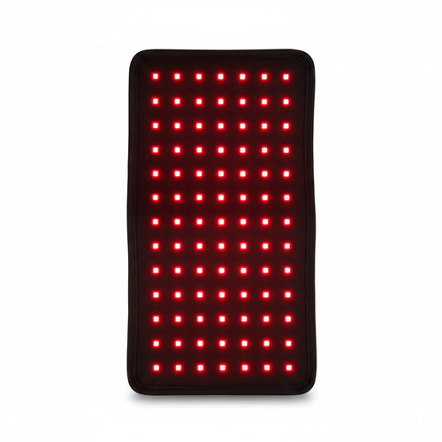 Red light therapy mat with UK plug, power adapter, and instructional manual on a white background.