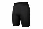 Black athletic shorts with 'Pro Combat' waistband on a white background