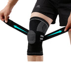 Person wearing a black knee brace with visible branding on a white background