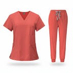 Coral medical uniform set with top and pants on a white background
