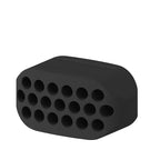 Black silicone mold with multiple holes on a white background