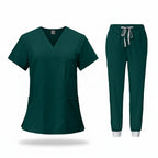 Green medical uniform set with top and pants on a white background
