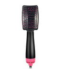 Hair styling tool with black bristle head and pink handle, shown with measurements on a white background.