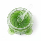 Aloe vera eye mask packaging with green aloe vera slices on a white background