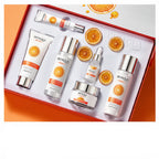 BIOAQUA skincare product set with orange packaging on a white background