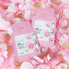 Fenyl cream packets on a bed of pink flowers