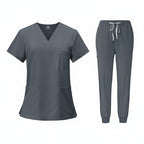 Gray medical uniform set with top and pants on a white background