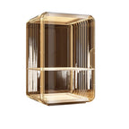 A multi-layered desktop cosmetic storage box elegantly displaying various skincare bottles and perfumes.