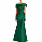 Green off-shoulder evening gown on a white background