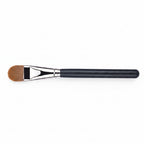 Ultra-thin foundation brush with black handle and silver ferrule on a white background