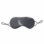 Gray sleep mask with feather details on a white background, featuring text about eye pressure relief.