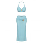 A two-piece swimsuit in light blue, featuring a halter bikini top and a matching high-waisted wrap skirt, both adorned with a gold starfish-shaped embellishment at the center front.