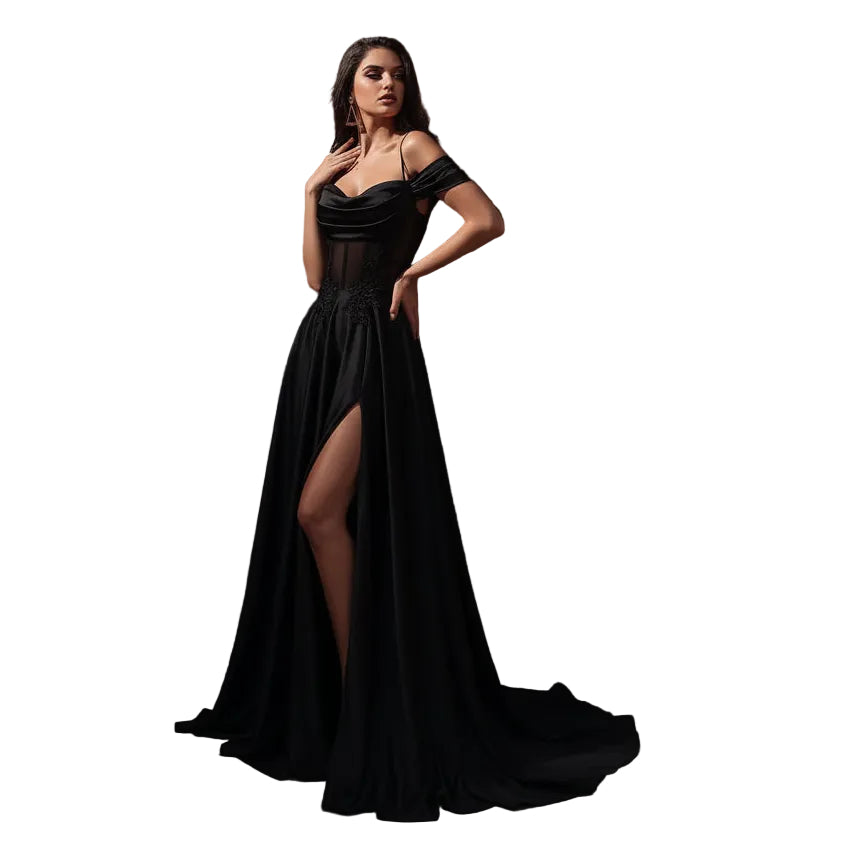 Woman in a black evening gown standing in an elegant interior setting
