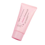 Pink exfoliating gel tube with cherry blossoms on a pink background