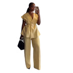 Person wearing a yellow outfit taking a mirror selfie.