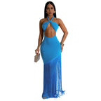 Woman wearing a blue fringe dress on a white background
