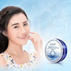 Woman with a smooth complexion holding a Bioaqua cream container against a light blue background