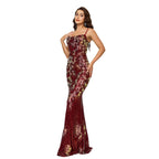 Woman wearing a floral evening gown on a white background