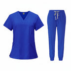 Blue medical uniform set with top and pants on a white background