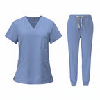 Medical uniform set with top and pants on a white background