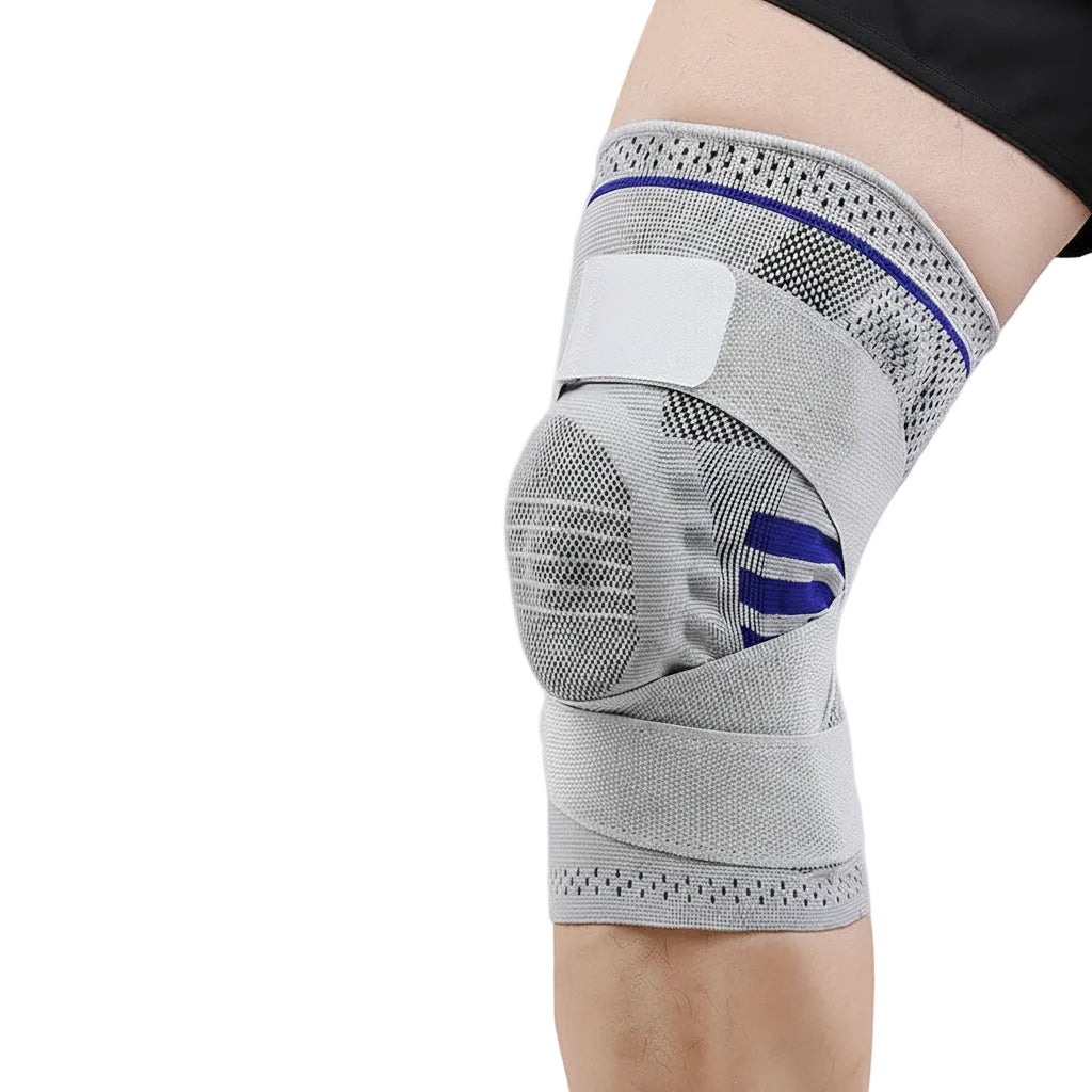 Gray knee brace with blue accents on a person's knee against a white background